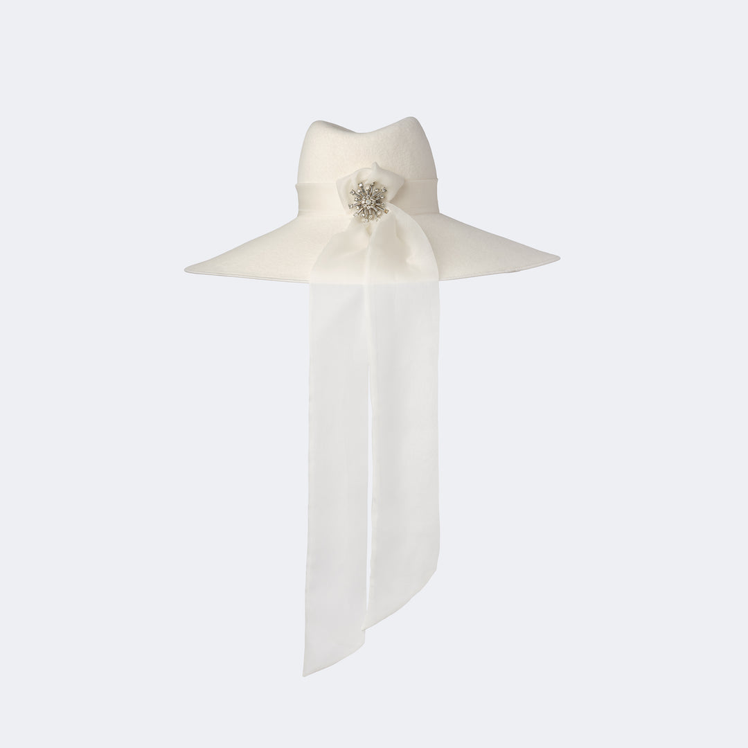 Ivory Bridal Phoenix Fedora showing the vintage brooch securing two flowing organza tails.